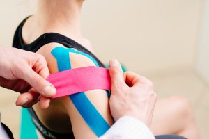 chiropractic-care-kinesio-tape-shoulder-pain-therapy